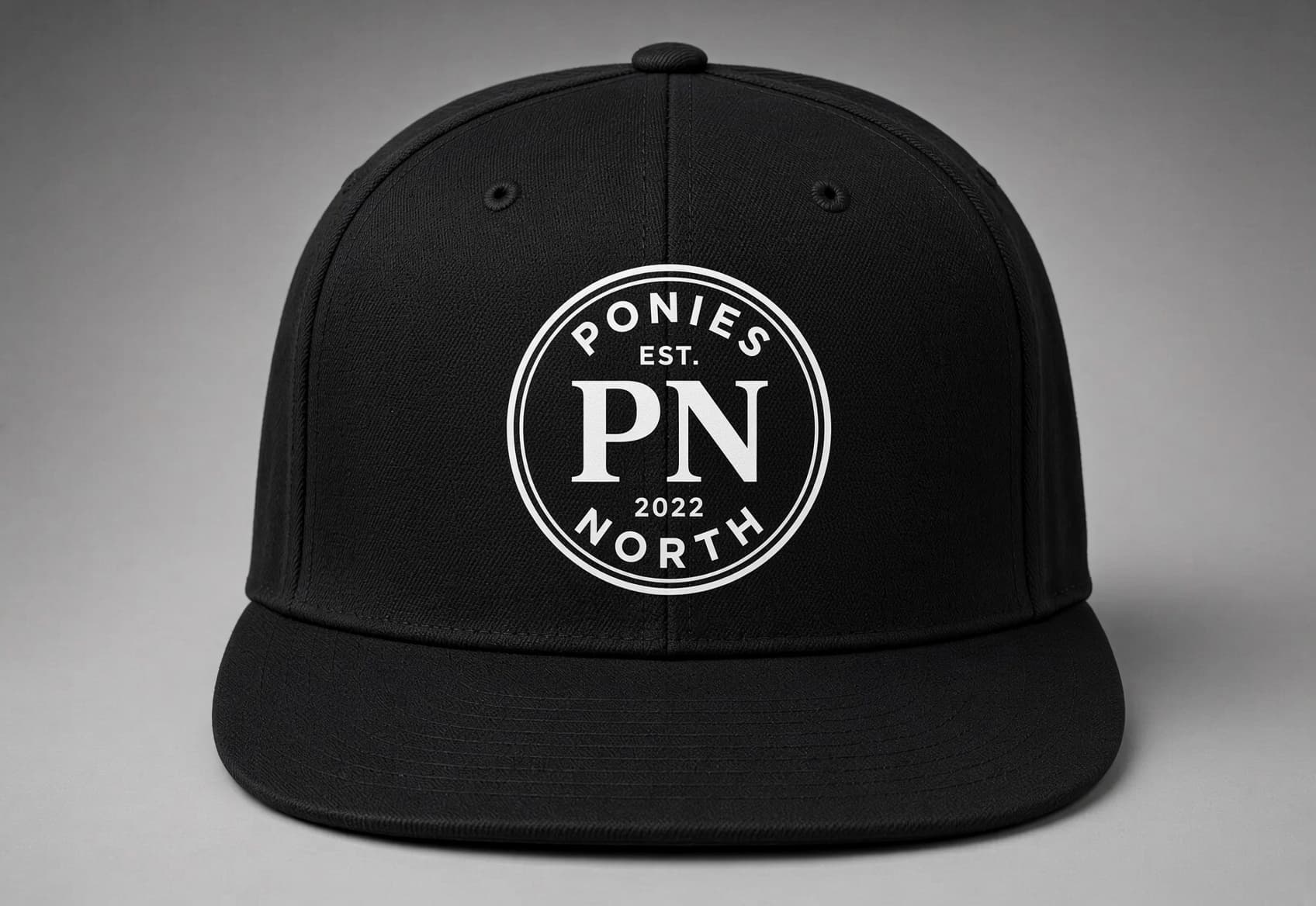 Front of the PN flatbill hat with the Ponies North logo